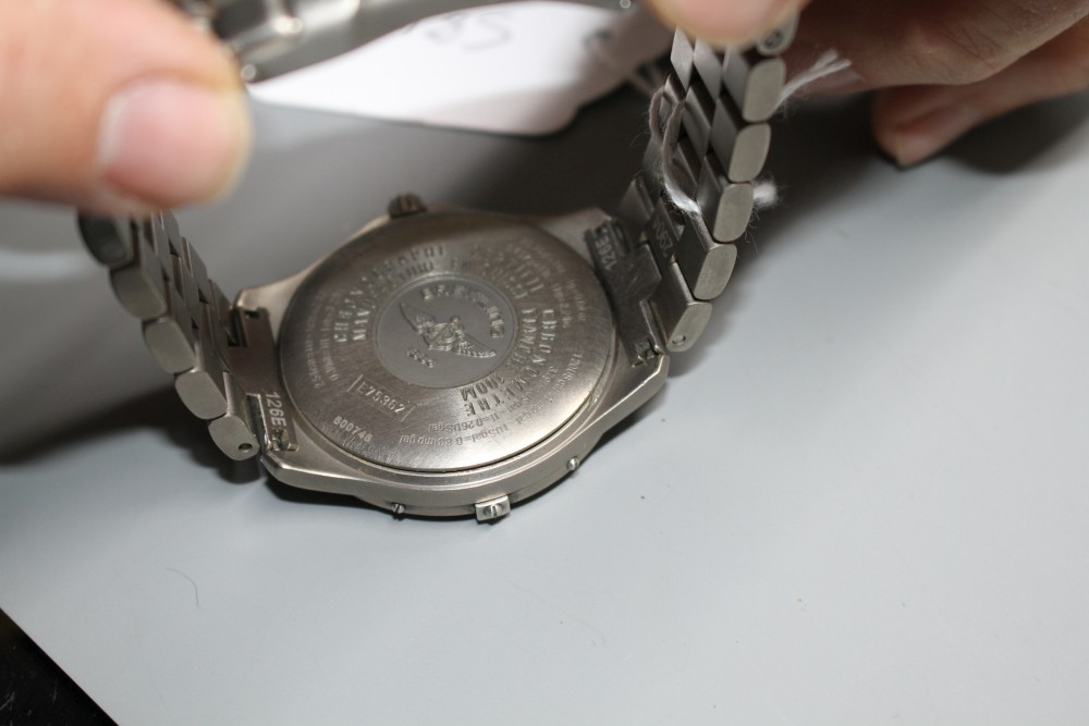 A gentlemans steel Breitling Aerospace quartz wrist watch, on Breitling bracelet.